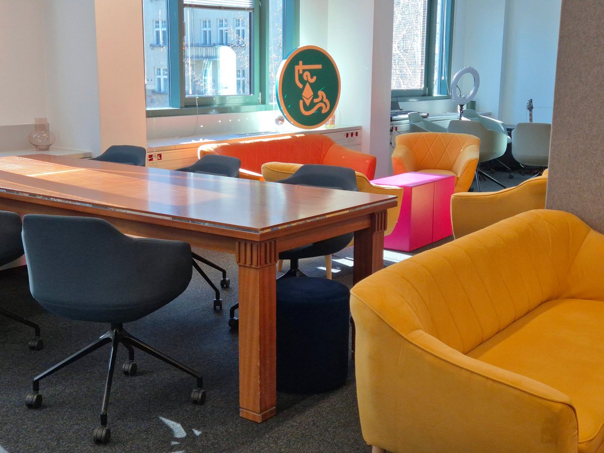 Meeting table and Kolektyw3 logo at Koszykowa 54